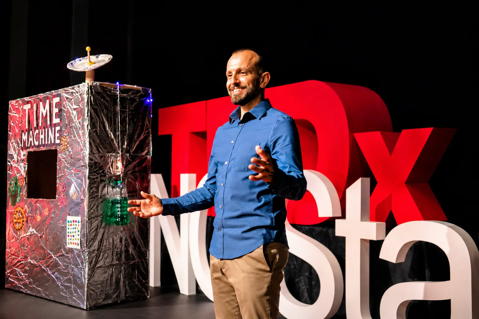 Mike Iskandar on the TEDx stage with his time machine
